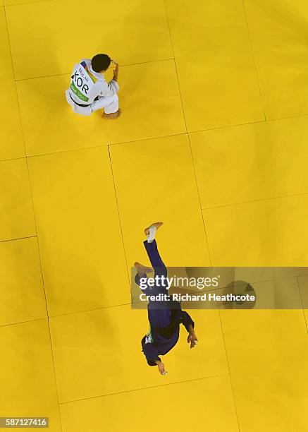 Fabio Basile of Italy performs a flip as he celebrates winning the gold medal against Baul An of Korea during the Men's -66kg gold medal final on Day...