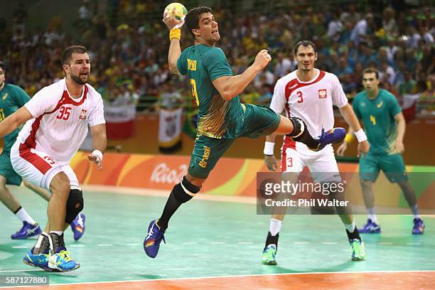 Jose Guilherme de Toledo of Brazil shoots during the Mens Preliminary Group B match between Poland and Brazil at the Future Arena on Day 2 of the Rio...