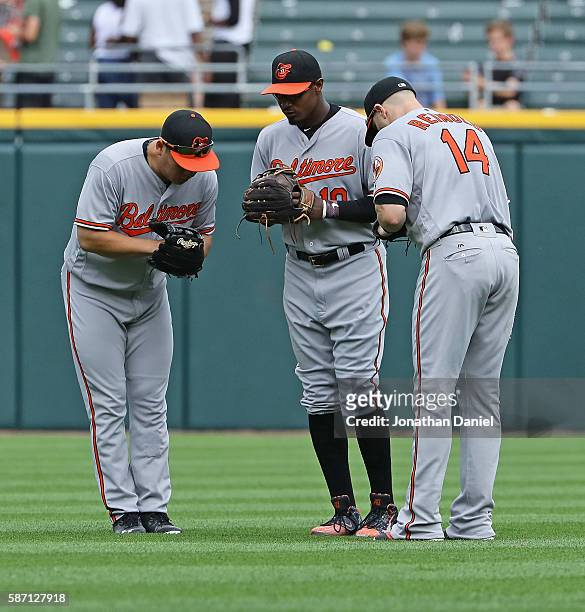 Hyun Soo Kim, Adam Jones and Nolan Reimold of the Baltimore Orioles celebrate w in over the Chicago White Sox at U.S. Cellular Field on August 7,...