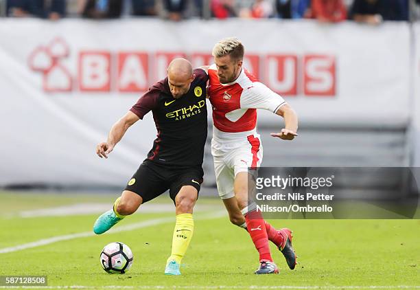 Pablo Zabaleta of Manchester City and Aaron Ramsey of Arsenal during the Pre-Season Friendly between Arsenal and Manchester City at Ullevi on August...