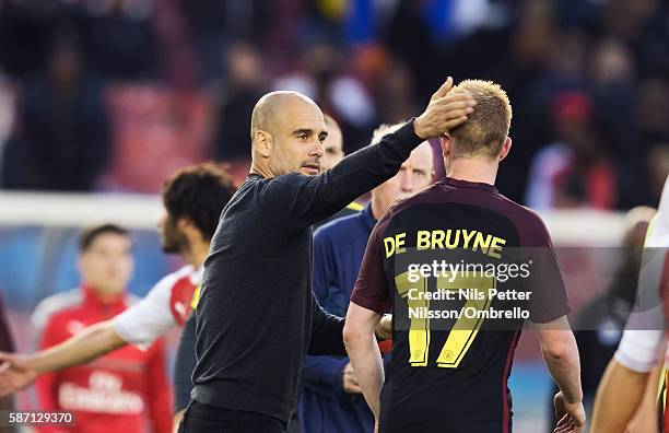 Pep Guardiola, head coach of Manchester City and Kevin de Bruyne of Manchester City during the Pre-Season Friendly between Arsenal and Manchester...