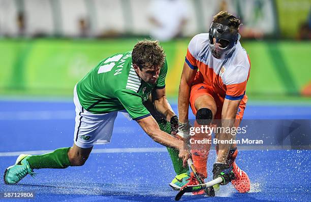 Rio , Brazil - 7 August 2016; John Jermyn of Ireland in action against Sander de Wijn of Netherlands during their Pool B match at the Olympic Hockey...