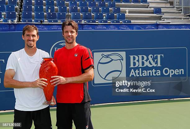 Horacio Zeballos and Andres Molteni of Argentina pose with the trophy after defeating Johan Brunstrom and Andreas Siljestrom of Sweden during the...