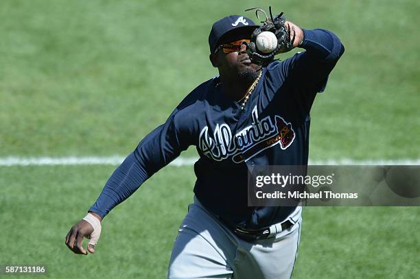 Adonis Garcia of the Atlanta Braves commits an error as he can't make the catch in foul territory in the seventh inning against the St. Louis...