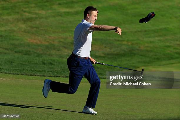 Russell Knox of Scotland reacts on the 18th green after winning the Travelers Championship during the final round of the Travelers Championship at...