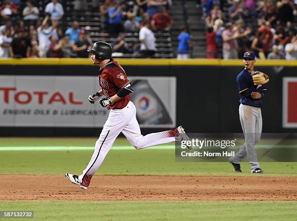 Phil Gosselin of the Arizona Diamondbacks rounds the bases after hitting a home run off of Michael Blazek of the Milwaukee Brewers during the fifth...