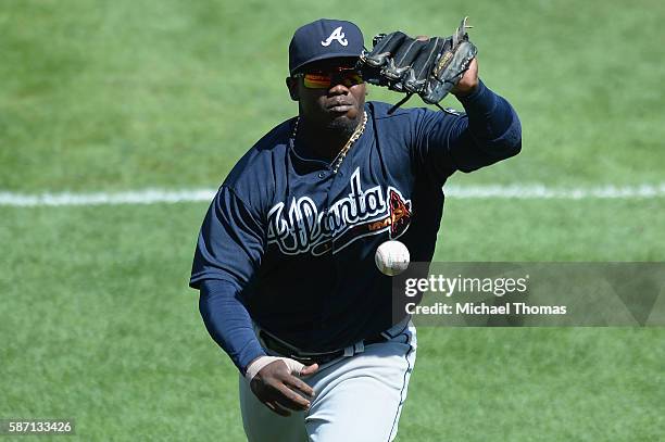Adonis Garcia of the Atlanta Braves commits an error as he can't make the catch in foul territory in the seventh inning against the St. Louis...