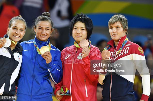 The Rio Olympic women's 52-kilogram judo gold medalist, Majlinda Kelmendi of Kosovo, poses for a photo on Aug. 7 with silver medalist Odette...