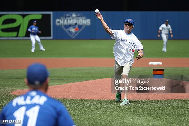 Mike Pillar the father of Kevin Pillar of the Toronto Blue Jays throws out the first pitch before the start of MLB game action against the Seattle...