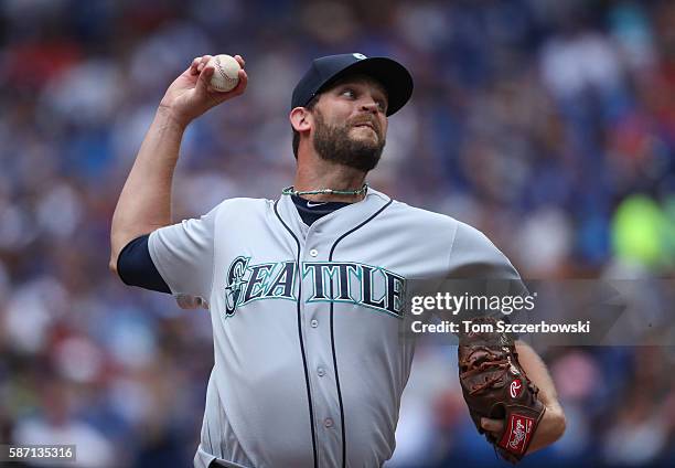 Tom Wilhelmsen of the Seattle Mariners delivers a pitch in the seventh inning during MLB game action against the Toronto Blue Jays on July 24, 2016...