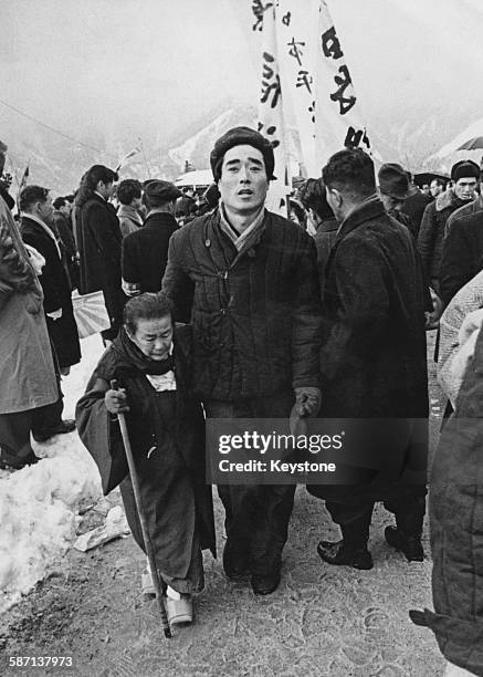 Mother is reunited with her son after he is released from a Soviet prisoner-of-war camp in Siberia, 31st December 1956. He and his fellow prisoners...