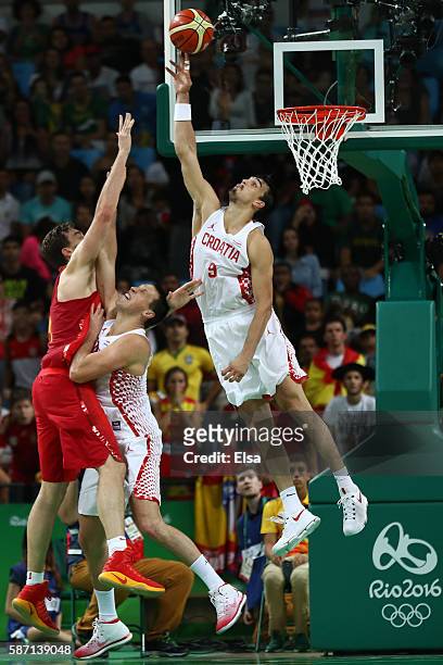 Dario Saric of Croatia blocks Pau Gasol of Spain during a Men's preliminary round basketball game between Croatia and Spain on Day 2 of the Rio 2016...