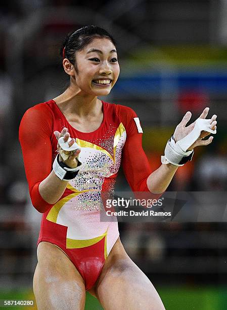 Yuki Uchiyama of Japan reacts after competing on the uneven bars during Women's qualification for Artistic Gymnastics on Day 2 of the Rio 2016...