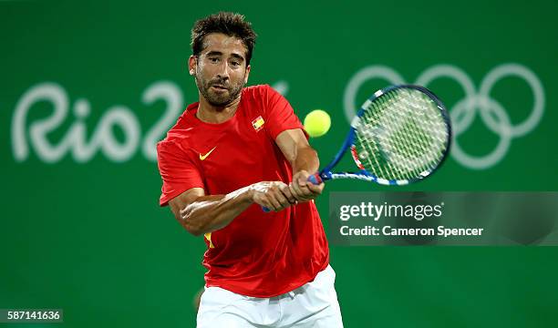 Marc Lopez of Spain in action against Robin Haase and Jean-Julien Rojer of Holland in their doubles match on Day 2 of the Rio 2016 Olympic Games at...