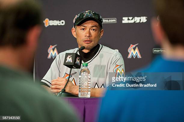 Ichiro Suzuki of the Miami Marlins talks to reporters during a post game press conference to discuss his 3,000th major league hit after the Miami...
