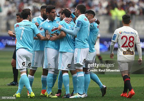 Renzo Revoredo of Sporting Cristal celebrates the first goal of his team against Universitario during a match between Universitario and Sporting...