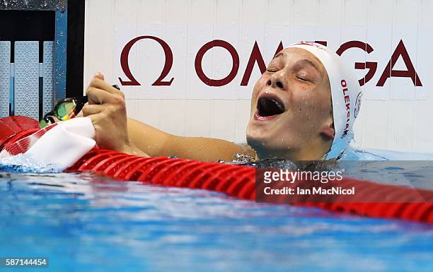 Penny Oleksiak of Canada elebrates after she wins silver in the Women's 100m Butterfly final during Day 2 of the Rio 2016 Olympic Games at Olympic...