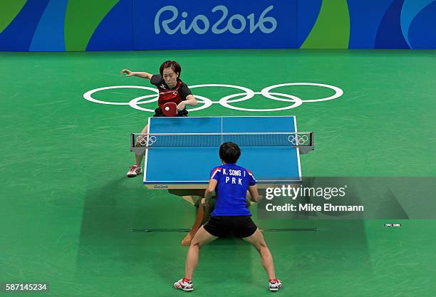 Kasumi Ishikawa of Japan plays a Women's Singles third round match against Song I Kim of the Peoples Republic of Korea on Day 2 of the Rio 2016...