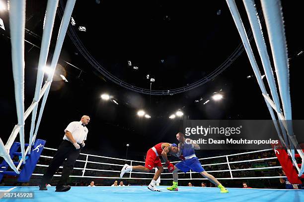 Mikhail Dauhaliavets of Belarus and Valentino Manfredonia of Italy compete in the Men's Light Heavy 81kg preliminary bout on Day 2 of the Rio 2016...
