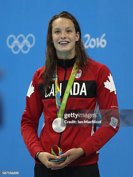 Penny Oleksiak of Canada poses with her silver imedal from the Women's 100m Butterfly final during Day 2 of the Rio 2016 Olympic Games at Olympic...