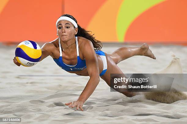 Marta Menegatti of Italy dives for the ball during the Women's Beach Volleyball preliminary round Pool D match against Jamie Lynn Broder and Kristina...