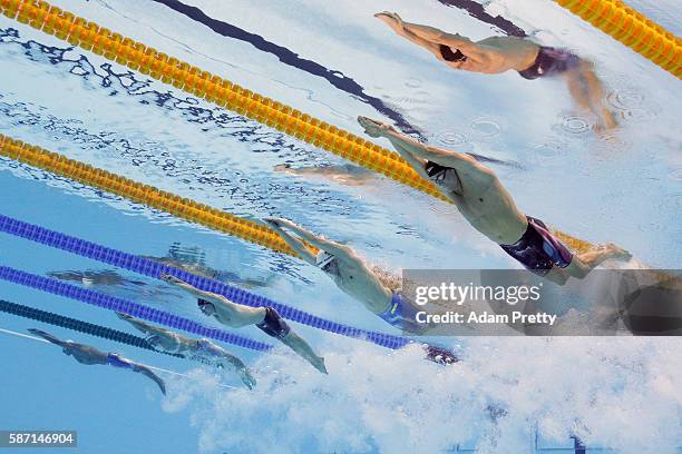 Conor Dwyer of the United States, Paul Biedermann of Germany and James Guy of Great Britain compete in the first Semifinal of the Men's 200m...