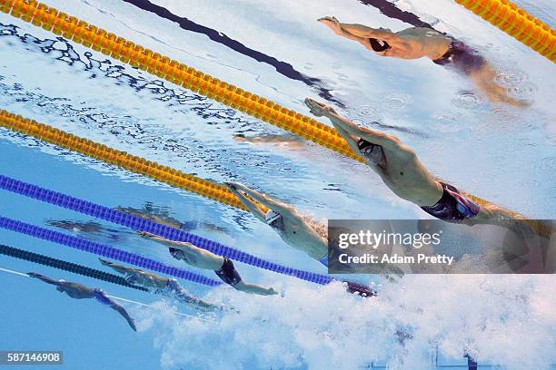 Conor Dwyer of the United States, Paul Biedermann of Germany and James Guy of Great Britain compete in the first Semifinal of the Men's 200m...