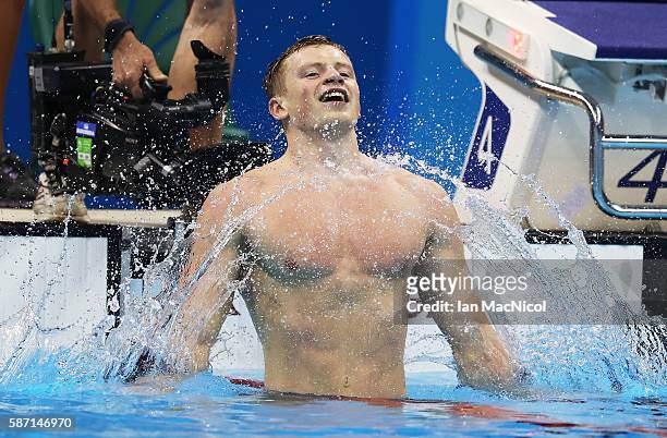 Adam Peaty of Great Britain celebrates winning the Men's 100m Breaststroke during Day 2 of the Rio 2016 Olympic Games at Olympic Aquatics Stadium on...