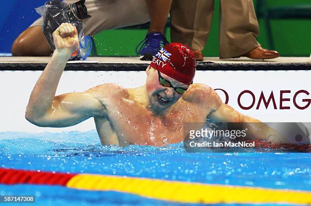 Adam Peaty of Great Britain celebrates winning the Men's 100m Breaststroke during Day 2 of the Rio 2016 Olympic Games at Olympic Aquatics Stadium on...