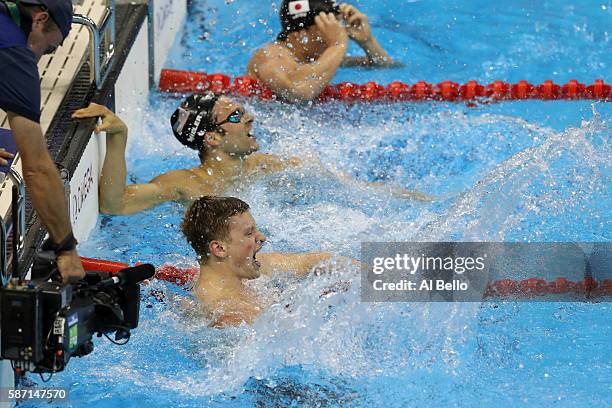 Adam Peaty of Great Britain celebrates winning gold and setting a new world record in the Men's 100m Breaststroke Final on Day 2 of the Rio 2016...