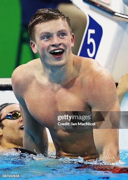 Adam Peaty of Great Britain celebrates winning the Men's 100m Breaststroke during Day 2 of the Rio 2016 Olympic Games at Olympic Aquatics Stadium on...