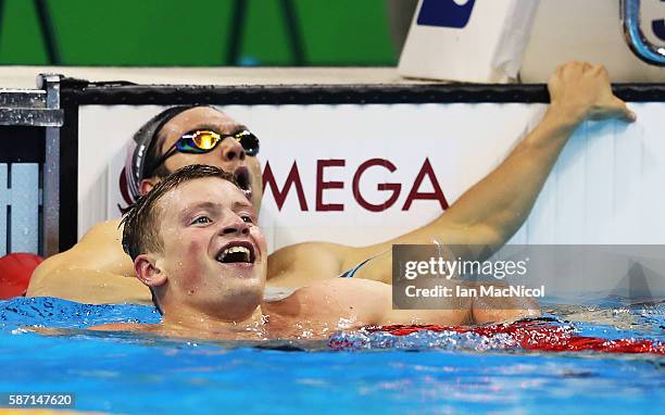 Adam Peaty of Great Britain celebrates winning the Men's 100m Breaststroke during Day 2 of the Rio 2016 Olympic Games at Olympic Aquatics Stadium on...