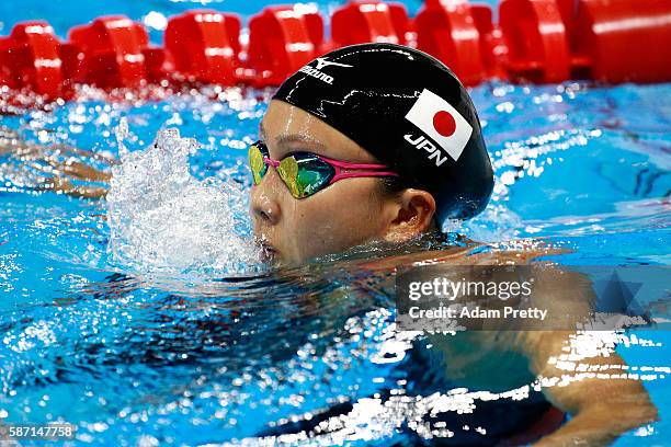 Kanako Watanabe of Japan reacts after the first Semifinal of the Women's 100m Breaststroke on Day 2 of the Rio 2016 Olympic Games at the Olympic...