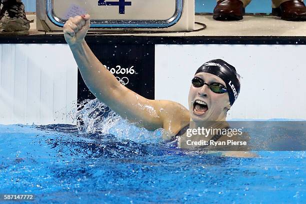 Katie Ledecky of the United States celebrates winning gold and setting a new world record in the Women's 400m Freestyle Final on Day 2 of the Rio...