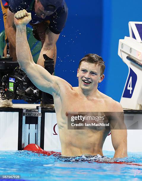 Adam Peaty of Great Britain celebrates winning the Men's 100m Breaststroke during Day 2 of the Rio 2016 Olympic Games at Olympic Aquatics Stadium on...