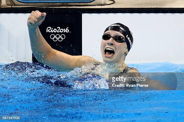 Katie Ledecky of the United States celebrates winning gold and setting a new world record in the Women's 400m Freestyle Final on Day 2 of the Rio...