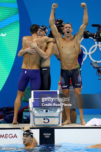 Team USA celebrate winning gold in the Final of the Men's 4 x 100m Freestyle Relay on Day 2 of the Rio 2016 Olympic Games at the Olympic Aquatics...