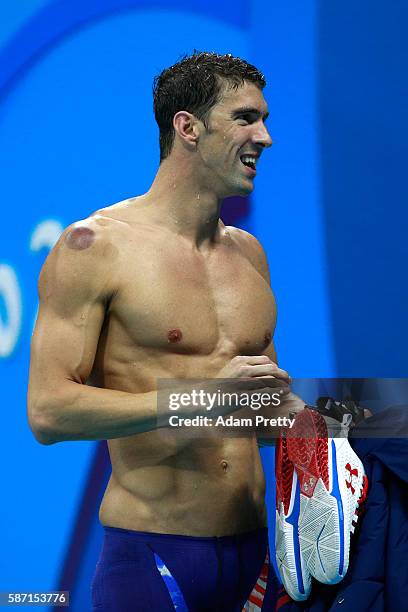 Michael Phelps of the United States celebrates winning gold in the Final of the Men's 4 x 100m Freestyle Relay on Day 2 of the Rio 2016 Olympic Games...