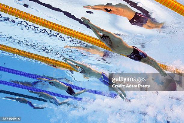 Conor Dwyer of the United States, Paul Biedermann of Germany and James Guy of Great Britain compete in the first Semifinal of the Men's 200m...