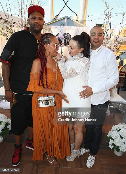 Sabathia and Amber Sabathia pose with Gia Casey and DJ Envy at a Surprise Baby Shower For Gia Casey Hosted By 50 Cent at STK on July 24, 2016 in New...