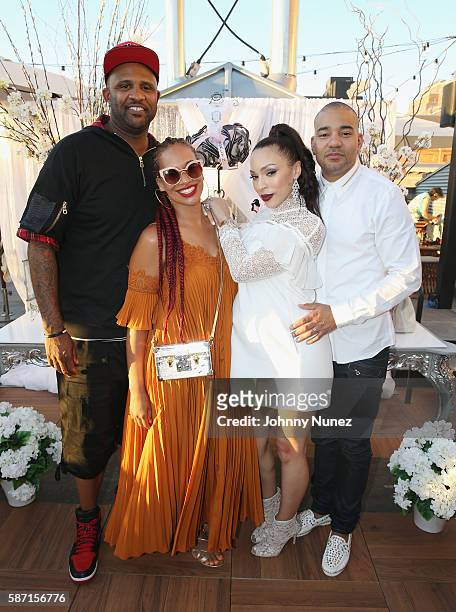 Sabathia and Amber Sabathia pose with Gia Casey and DJ Envy at a Surprise Baby Shower For Gia Casey Hosted By 50 Cent at STK on July 24, 2016 in New...