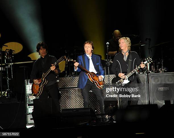 Singer Paul McCartney, guitarist Brian Ray, guitarist Rusty Anderson and drummer Abe Laboriel Jr. Perform from the One On One Tour at MetLife Stadium...