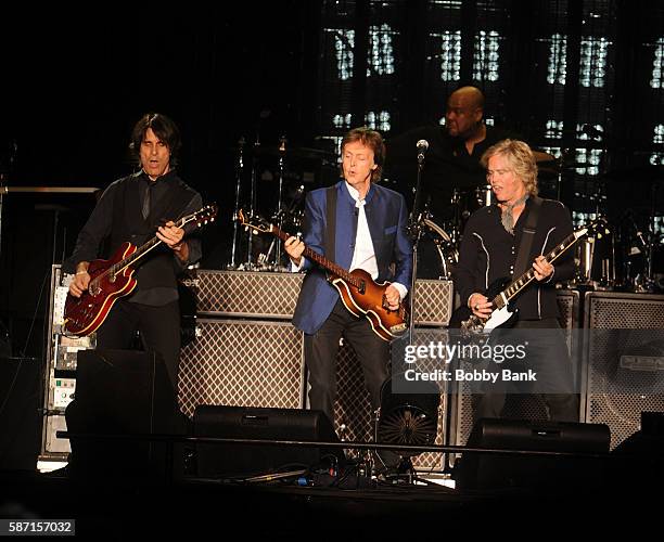 Singer Paul McCartney, guitarist Brian Ray, guitarist Rusty Anderson and drummer Abe Laboriel Jr. Perform from the One On One Tour at MetLife Stadium...