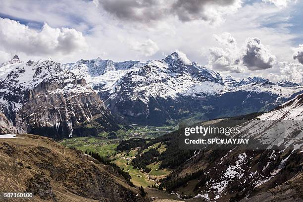 grindelwald city and alps mountain range from first - schreckhorn stock-fotos und bilder