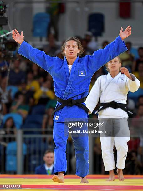 Majlinda Kelmendi of Kosovo, blue, celebrates her u52kg gold medal victory over Odette Giuffrida of Italy on day 2 of the 2016 Rio Olympic Judo on...