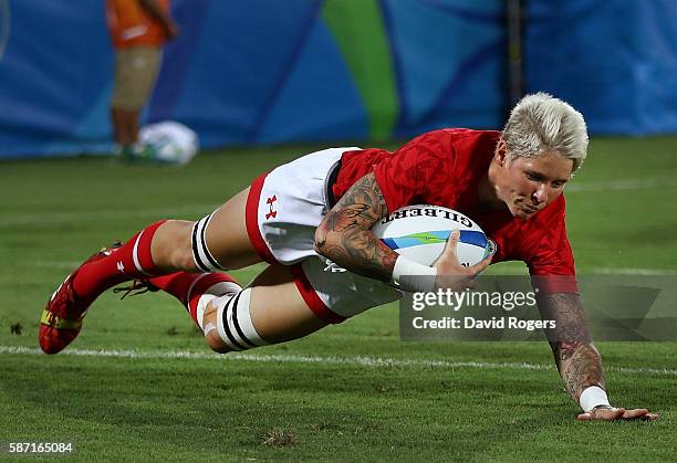 Jennifer Kish of Canada dives to score a try during a Women's Pool C rugby match between Canada and Brazil on Day 1 of the Rio 2016 Olympic Games at...