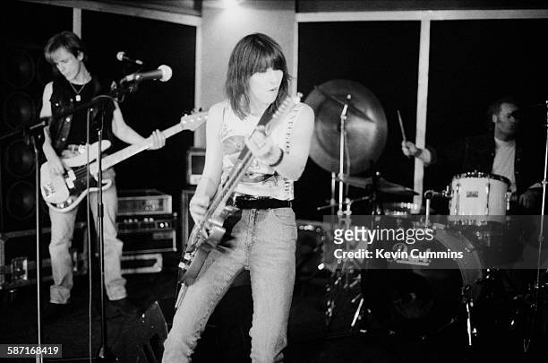 Malcolm Foster, Chrissie Hynde and Martin Chambers of rock group, The Pretenders, in a rehearsal studio, London, March 1994.