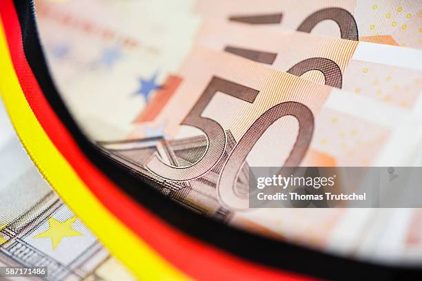 Berlin, Germany 50 Euro bills with a ribbon in the national colors of Germany on August 08, 2016 in Berlin, Germany.