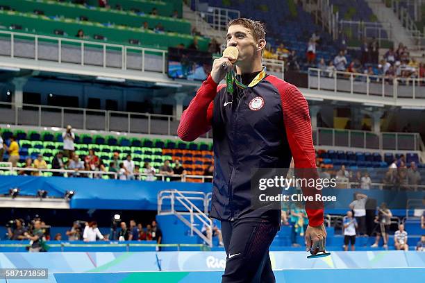 Michael Phelps of the United States celebrates after winning the gold medal in the Men's 4 x 100m Freestyle Relay on Day 2 of the Rio 2016 Olympic...