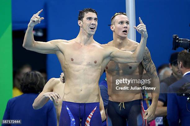 Michael Phelps and Caeleb Dressel of the United States celebrate winning gold in the Final of the Men's 4 x 100m Freestyle Relay on Day 2 of the Rio...